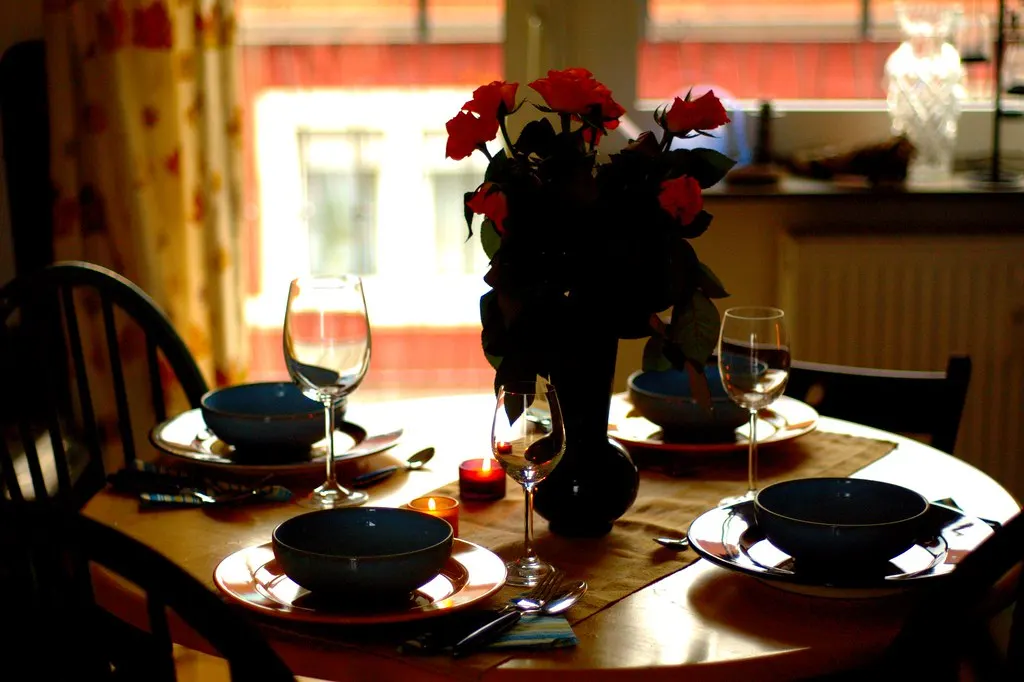 Low coffee table with floor cushions, plates and mini pumpkins set for a casual dinner